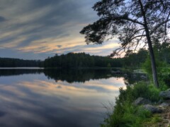 This picture was taken on a lake near Olafström in the south of Sweden. It was in summer 2010 near midnight. This picture was taken on a lake near Olafström in the south of Sweden. It was in summer 2010 near midnight.